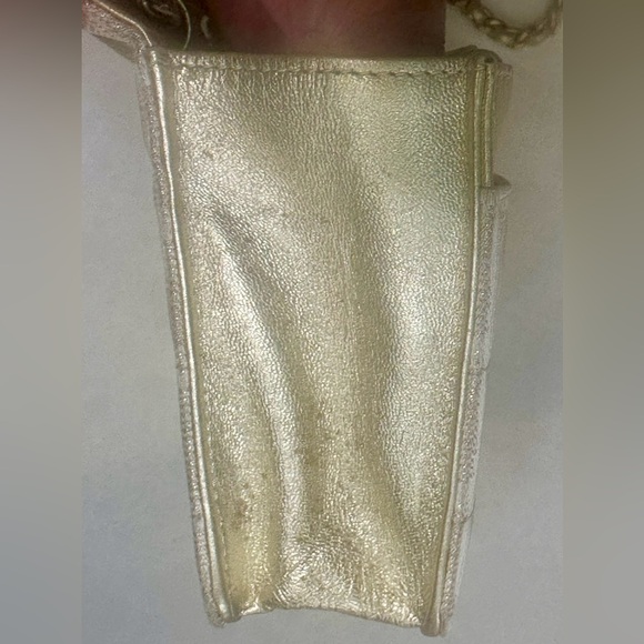Chanel Travel Ligne Wallet On Chain in Gold with CCs running trough the canvas - Picture 9 of 14